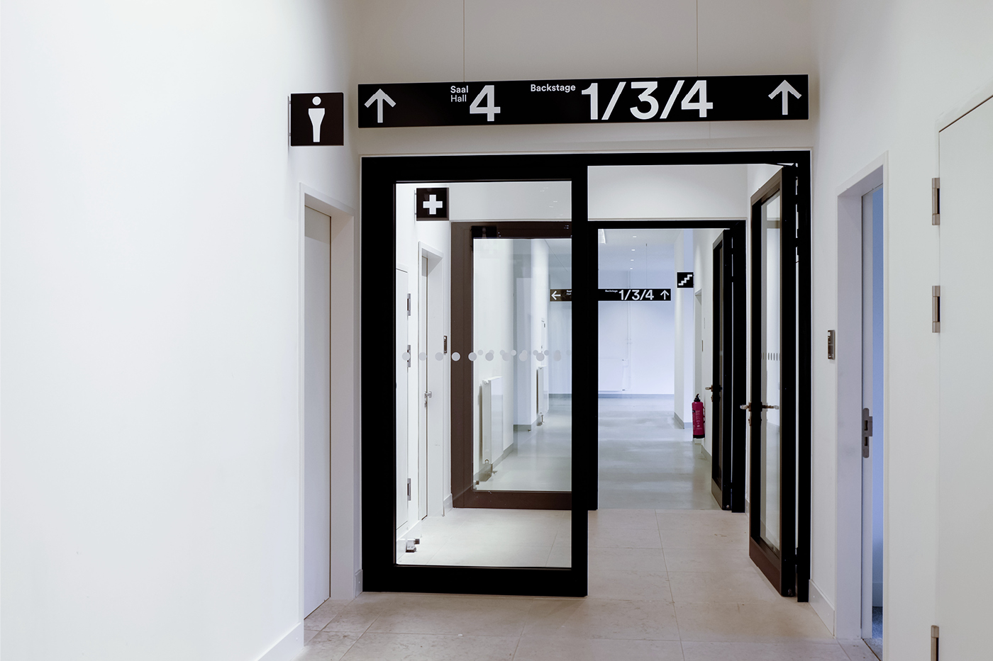 Directional lighting signs and lavatory identification signs
